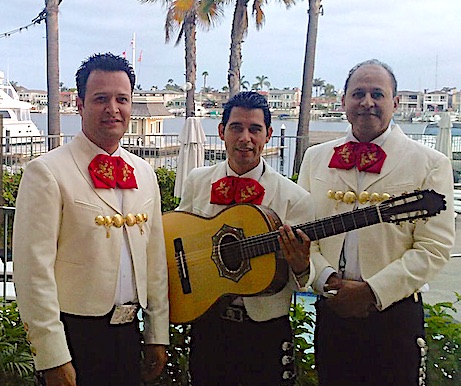 Trio Acapulco pose for photo at a restaurant in the Marina